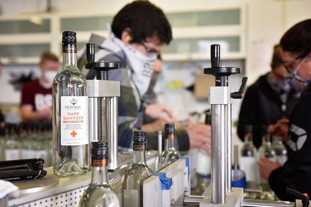Heritage Distilling staff working to make sanitizer available for purchase